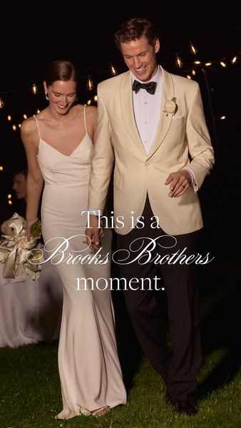 This image ad is for Brooks Brothers, and it highlights a wedding or black-tie event. A couple is holding hands walking 