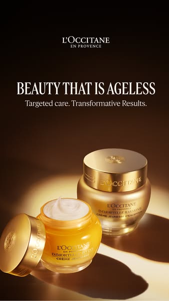 The ad showcases L'Occitane en Provence's skincare products, emphasizing their age-defying benefits. The image f