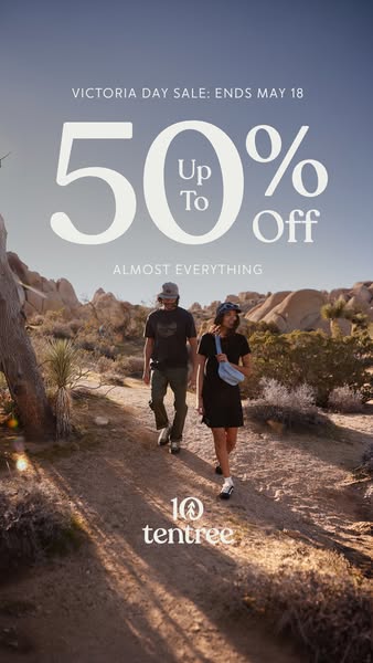 This image ad for tentree promotes a Victoria Day sale with 50% off almost everything. It features a couple walking in a