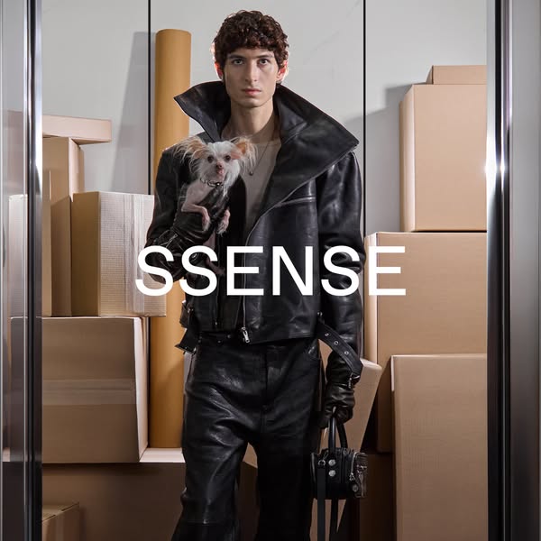 This ad showcases SSENSE, an online fashion retail platform. It features a person in a leather jacket holding a dog, sur