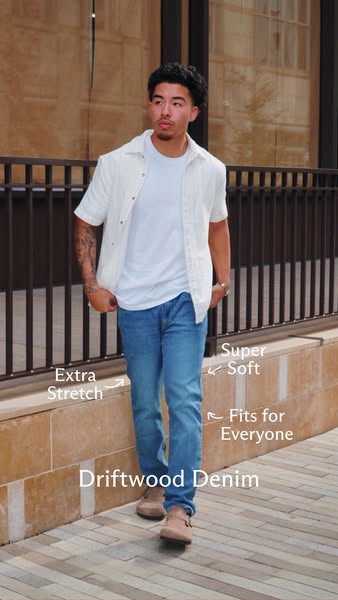 This image ad showcases a man modeling 'Driftwood Denim' jeans, emphasizing their 'extra stretch' and &#