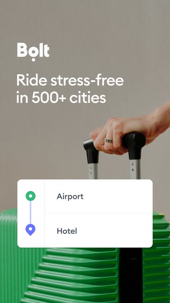 This ad for Bolt promotes stress-free rides in 500+ cities. It features a hand holding the handle of a green suitcase, w