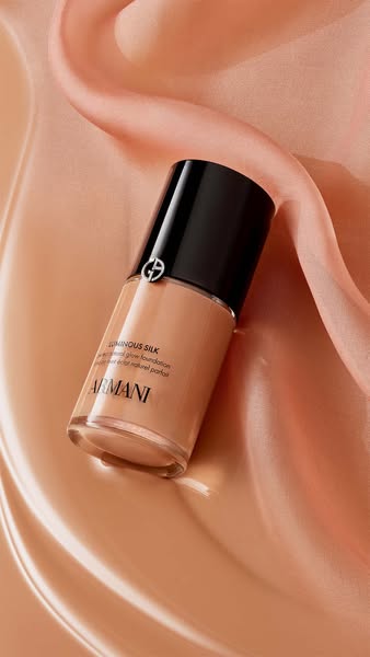 This ad showcases a bottle of Giorgio Armani Luminous Silk foundation against a satin background. The ad focuses on the 