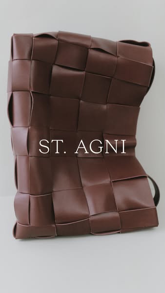 A single image shows a close-up of a brown leather St. Agni woven bag.