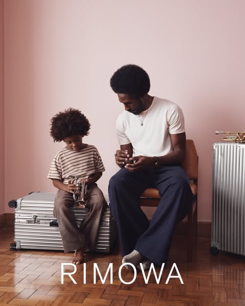 An advertisement for RIMOWA luggage featuring a father and son, showcasing the brand's appeal to family travel and t