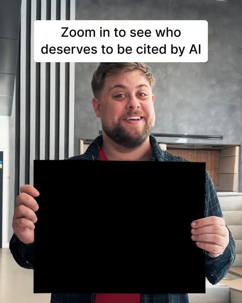 A creator is prompting people to zoom in on a black sign they are holding to reveal a person who deserves to be cited by