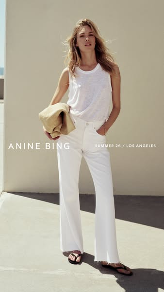 This ad features a model wearing white jeans and a white tank top. The ad promotes Anine Bing’s summer collection, set i