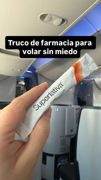 The ad features a hand holding a Superlativa Forte supplement sachet inside an airplane. The text overlay reads, "P