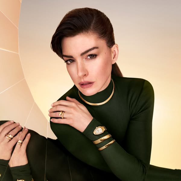 This ad features Anne Hathaway wearing Bulgari jewelry and a watch. The ad showcases the brand's luxury and elegance