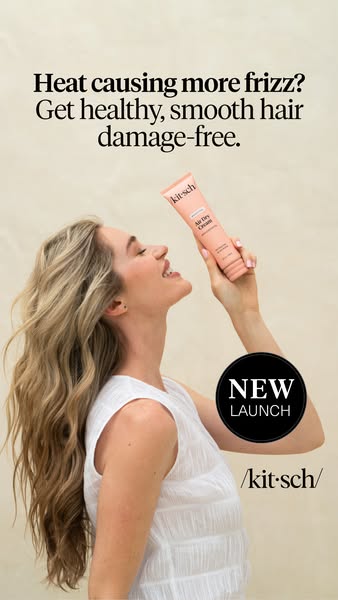 This ad for Kitsch Air Dry Cream features a woman with wavy blonde hair holding the product up and smiling. The ad copy 
