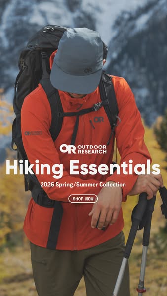 This ad is for Outdoor Research hiking essentials. It showcases a hiker in the mountains wearing clothes and gear from t