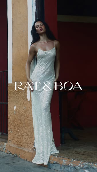 An image ad for Rat & Boa features a woman in a sequin dress in a narrow space between two buildings.