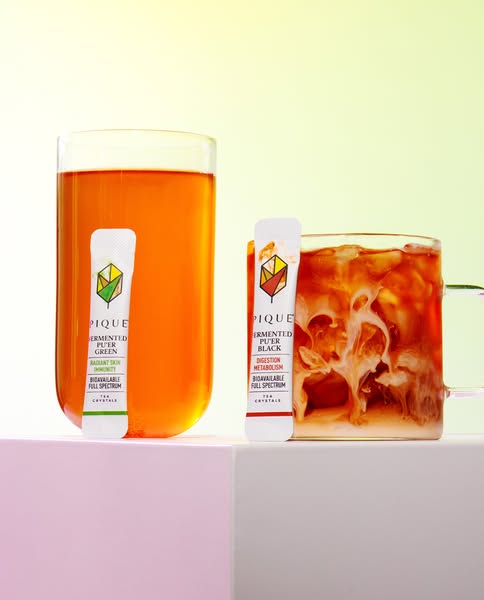 This ad features Pique tea crystals, highlighting two varieties: Fermented Puer Green for radiant skin and immunity, and
