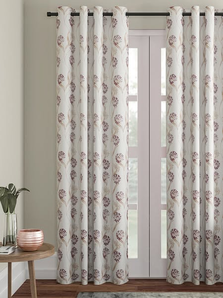 This ad features a pair of curtains with a floral pattern, showcasing their design and potential use in a home setting.