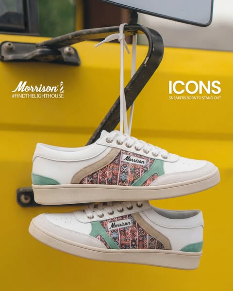 This ad showcases two Morrison brand sneakers hanging from a yellow vehicle.