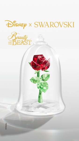 This ad features a crystal-covered rose under a glass dome, as seen in Disney's Beauty and the Beast, promoting the 