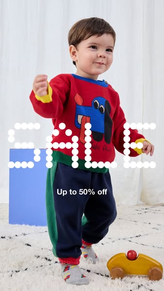 This ad showcases a young child wearing a colorful outfit from the brand, highlighting a sale of up to 50% off.