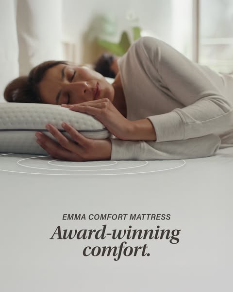 This image ad for Emma Sleep features a woman sleeping on an Emma Comfort Mattress. The ad highlights the award-winning 