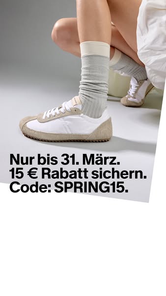 The ad features a close up of a woman wearing sneakers with a discount offer.