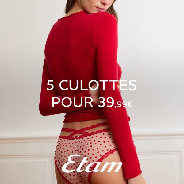 An image ad showing a woman wearing an Etam brand red long-sleeved shirt and red and pink heart patterned culottes. The 