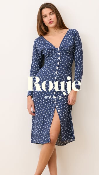 This is an image ad for Rouje Paris highlighting a blue button-down dress. The model is shown wearing the dress while po