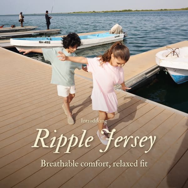 An advertisement for Ripple Fersey clothing. The ad features two children, a boy and a girl, walking on a dock alongside