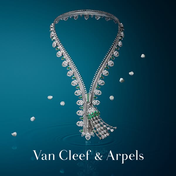 This ad showcases a Van Cleef & Arpels necklace, emphasizing its design and craftsmanship. The necklace is displayed