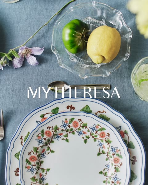 This ad showcases MYTHERESA's selection of floral plates. The ad features a flatlay shot of the plates.