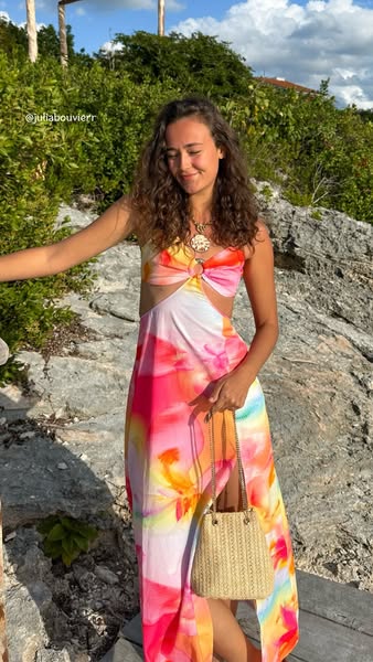 This ad features an influencer showing off a dress.