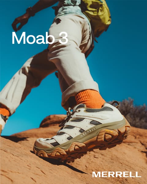 This image ad shows a person hiking in Merrell Moab 3 hiking shoes. The shot is low to the ground so the hiking shoe is 