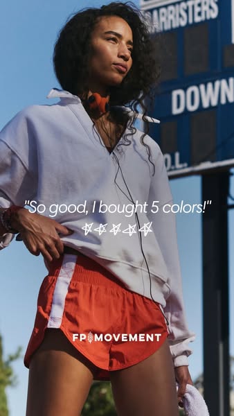 The ad features a testimonial promoting FP Movement apparel. A model wears the brand's orange athletic shorts and a 