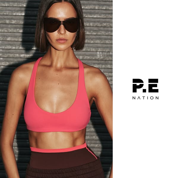 This ad features an image of a woman in P.E Nation activewear. The ad likely aims to showcase the brand's stylish an
