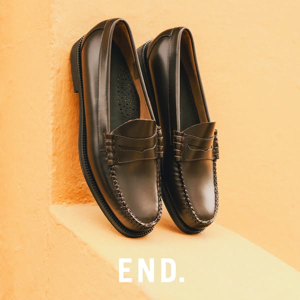 This image ad showcases a pair of dark brown leather loafers, emphasizing their high-quality construction and classic st