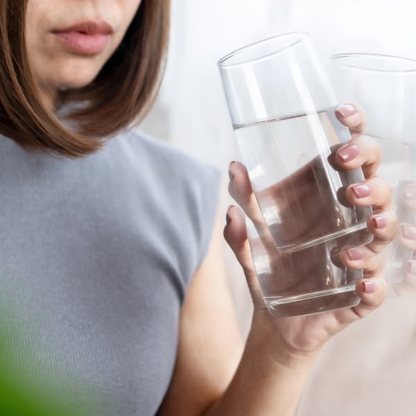 This ad is aimed to promote the importance of staying hydrated. The ad shows a woman holding a glass of water.