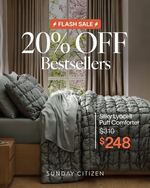 A cozy image of a bed with the Sunday Citizen Silky Lyocell Puff Comforter, highlighting a 20% off flash sale on bestsel
