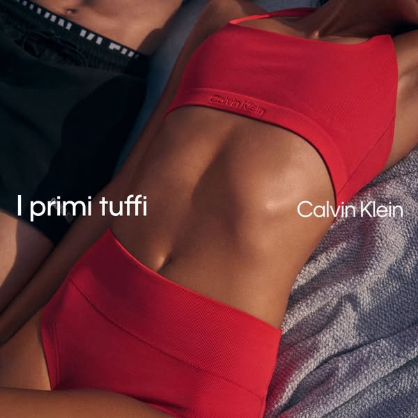 This ad for Calvin Klein shows a model wearing a matching ribbed bralette and high-waisted underwear set while laying on