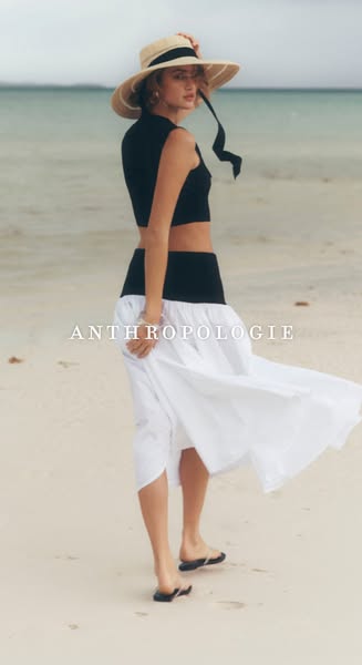 This ad showcases apparel from Anthropologie, featuring a model in a black crop top, a black waistband, and a white skir