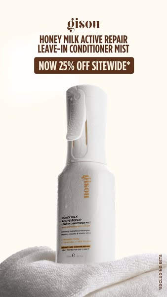 This image ad promotes Gisou's Honey Milk Active Repair Leave-in Conditioner Mist with an offer of 25% off sitewide.
