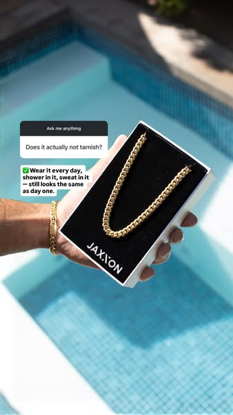 The ad shows a close up shot of a JAXXON necklace being held in its case with an Instagram question sticker asking if it