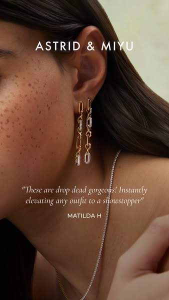 A close-up of a person wearing Astrid & Miyu earrings, accompanied by a customer testimonial.