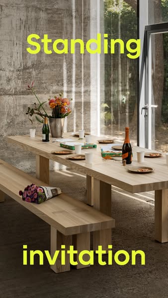 The image ad shows a dining room with a long wooden table set for a casual meal. The setting suggests an invitation to g