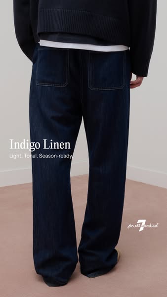 This ad showcases a pair of indigo linen pants from 7 For All Mankind. It emphasizes the light, tonal, and season-ready 