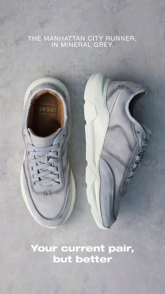 This ad features a close-up shot of two Greats brand 'Manhattan City Runner' sneakers in 'Mineral Grey'