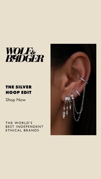 An image ad showcasing a curated collection of silver hoop earrings from Wolf & Badger.