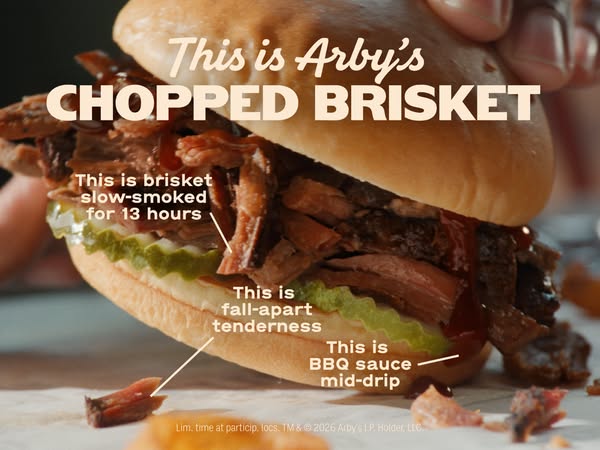 This image ad showcases Arby's chopped brisket sandwich, emphasizing the quality and tenderness of the brisket and h