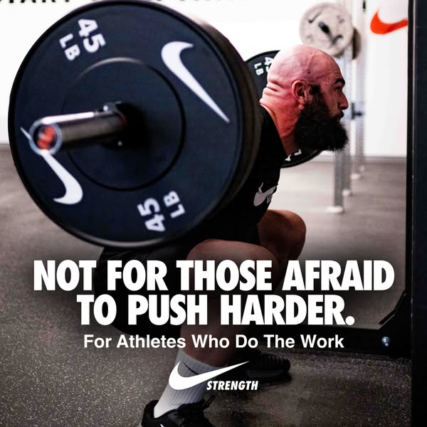 This image ad by Nike encourages athletes to push themselves. It features a man lifting weights in a gym and includes te