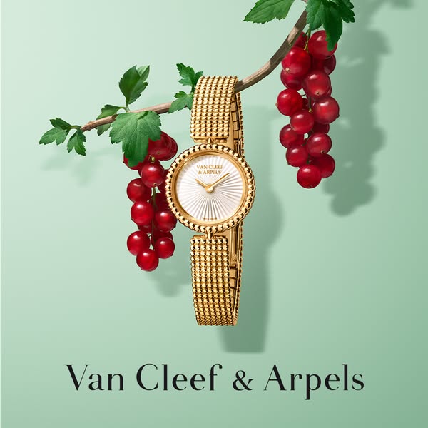 This is a promotional ad for Van Cleef & Arpels, showcasing their gold watch.