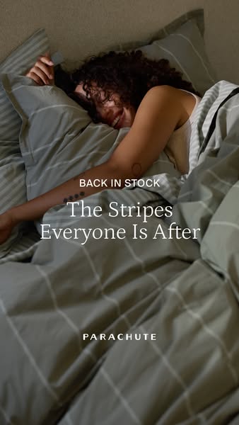 An image ad showcasing a person laying in bed with Parachute brand striped bedding. The ad highlights that the striped b