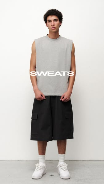 This ad shows a person wearing a gray sleeveless shirt and black cargo shorts.