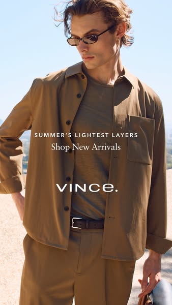 This ad is a full body portrait of a male model wearing an unbuttoned, neutral-toned, button-down shirt over a neutral t